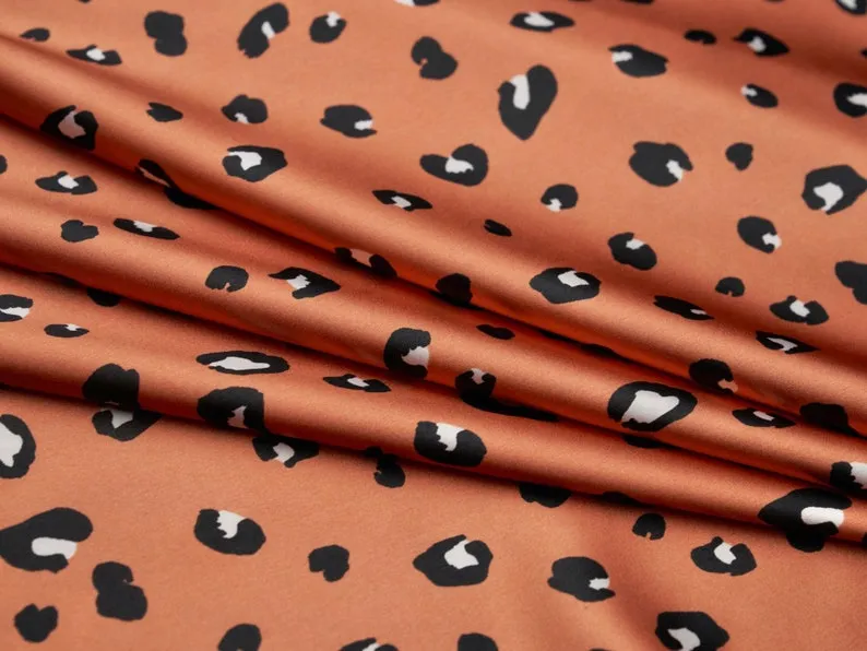 Faux silk cheetah satin fabric by the yard